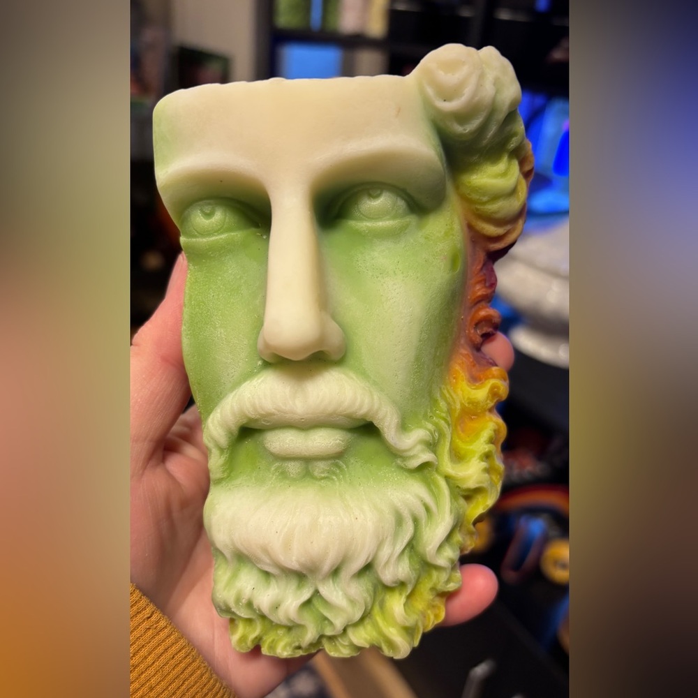 Half Zeus face candle made with soy and paraffin wax